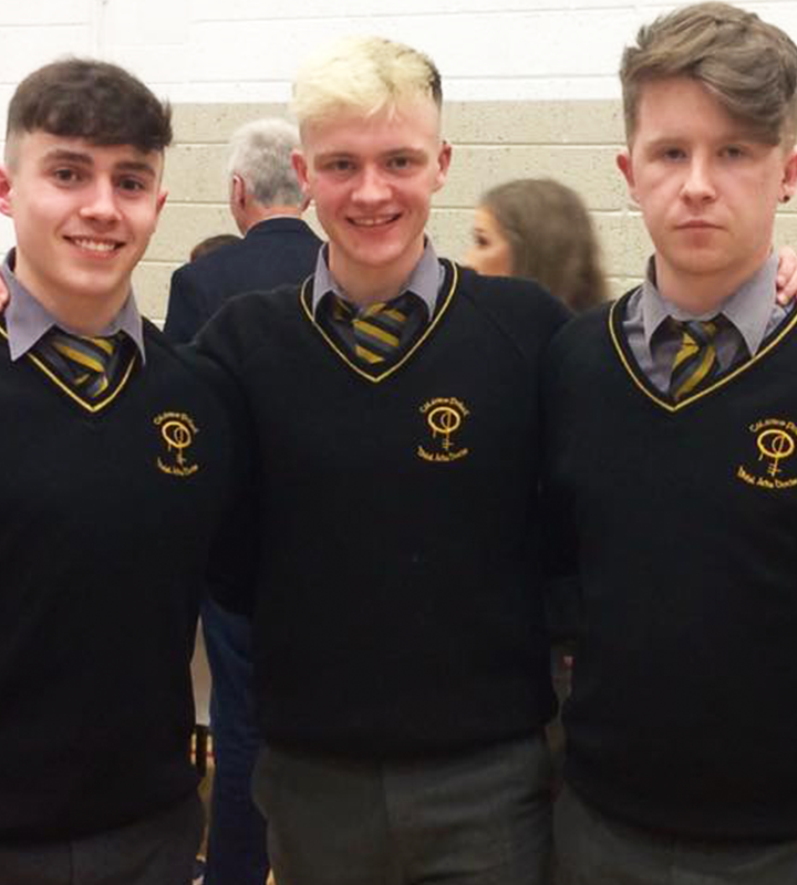 Three male students smiling