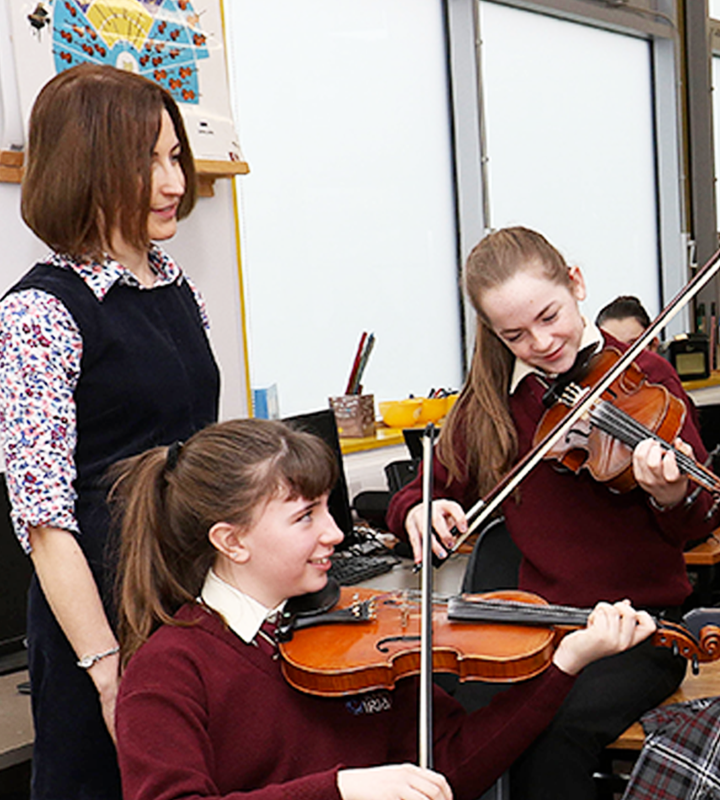 Two students playing violin