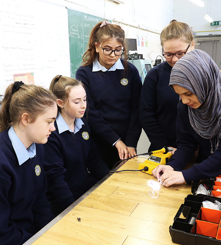 A teacher demonstrating a puzzle