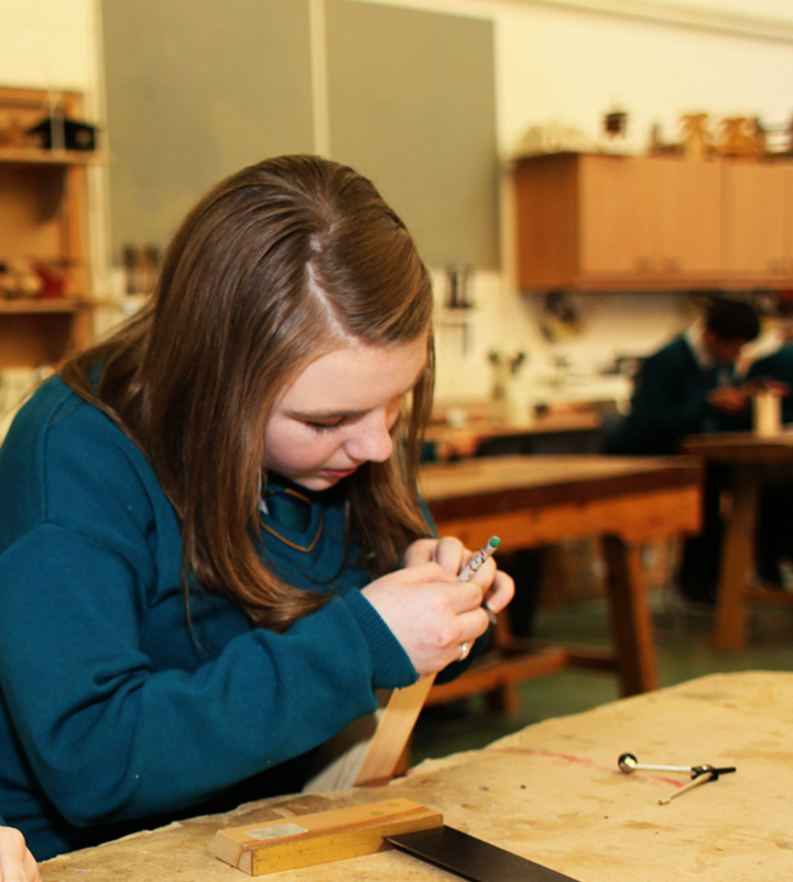 A student working on woodwork