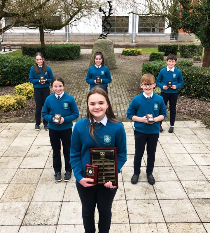 Largy College learners holding awards