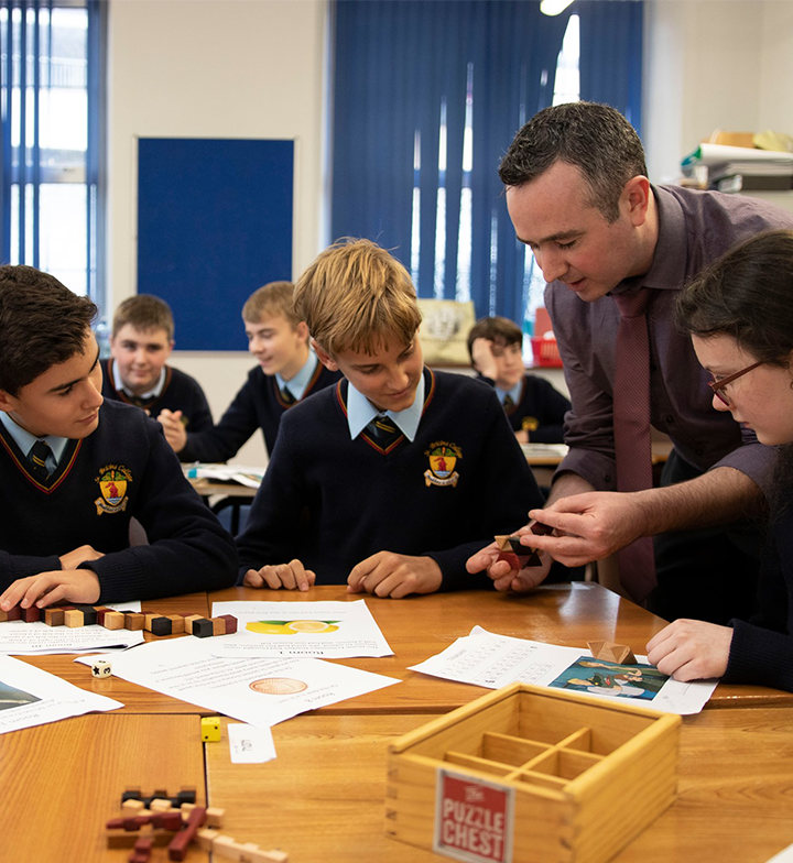 A teacher demonstrating a puzzle