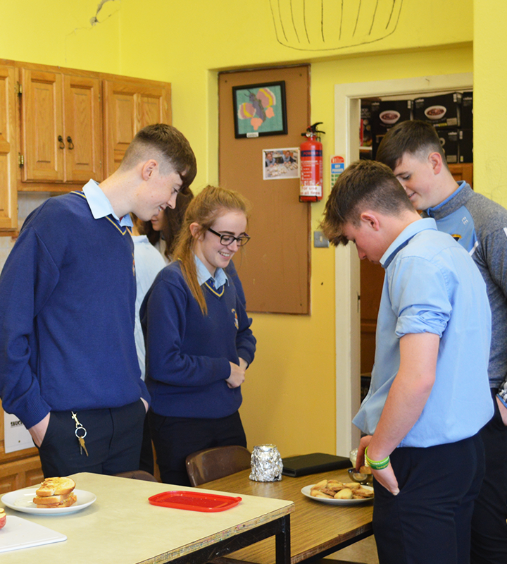 Four students cooking