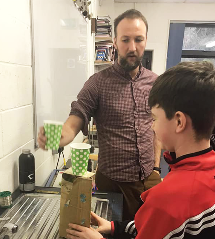 A teacher demonstrating a puzzle